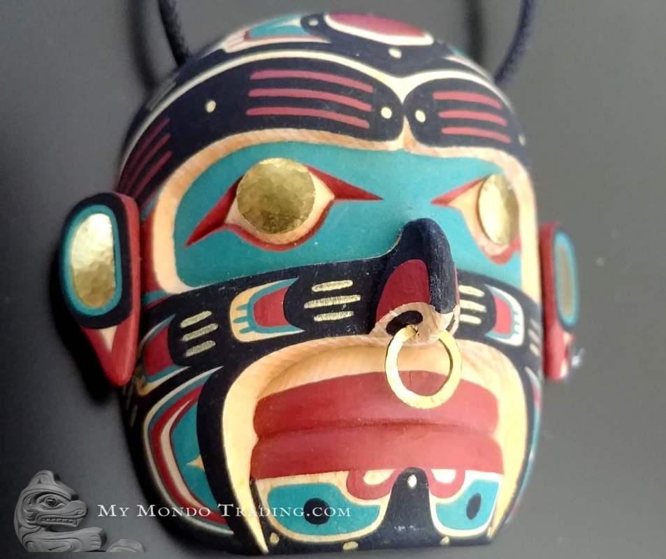 Namgis (Human) mask pendant by Kevin Cranmer