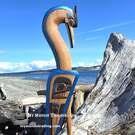 Double sided Heron sculpture, salmon base, Heiltsuk artist Charles George Sr. 