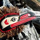 Raven with lots of cedar bark, wall art carving by Sarah Daniels
